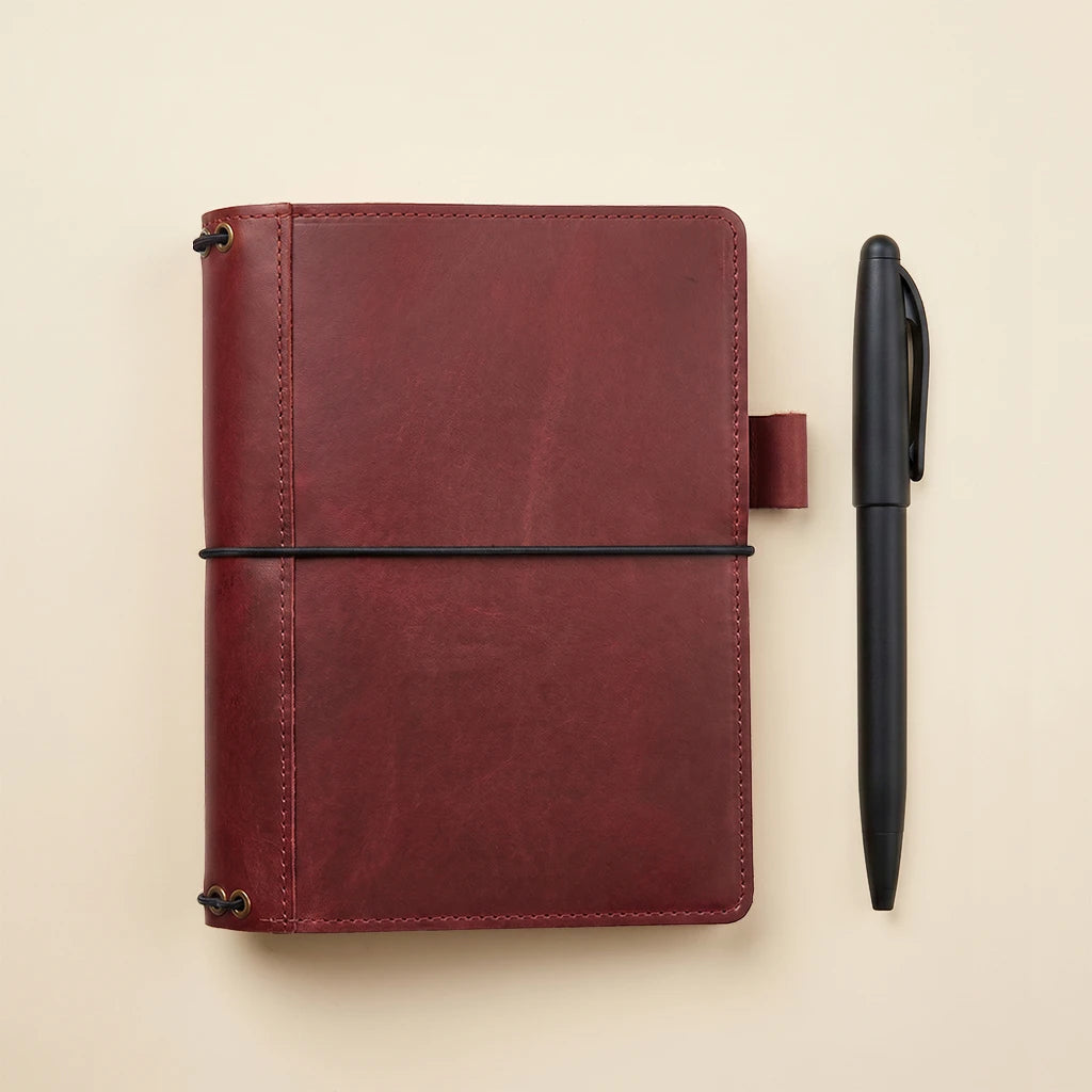 Durable leather notebook cover with five elastic inserts and storage pockets