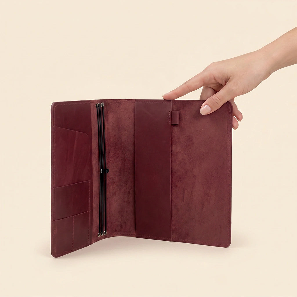 Leather notebook organizer with premium leather finish and secure notebook retention system.