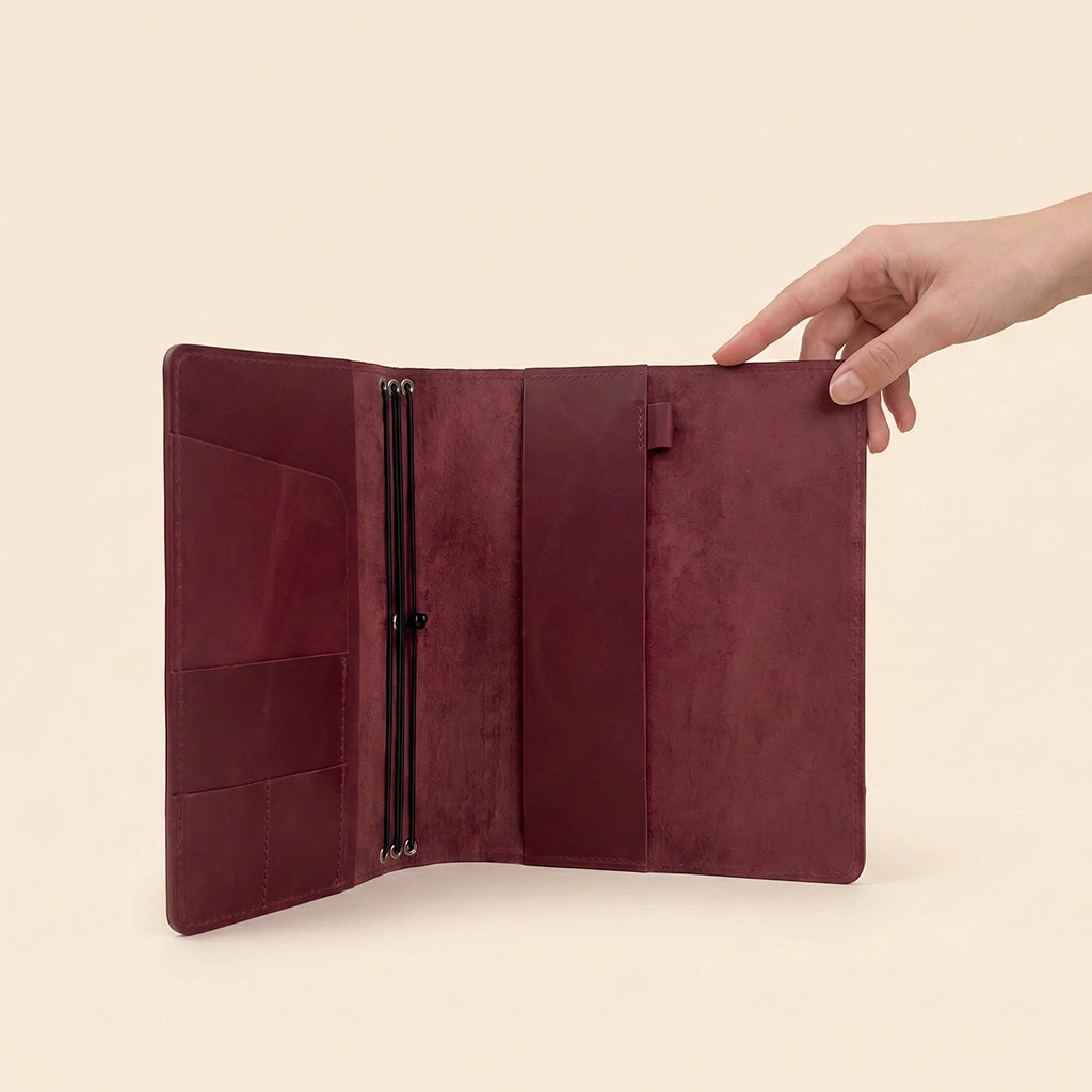 Leather notebook organizer with premium finish, elastic holders, and card storage compartments.