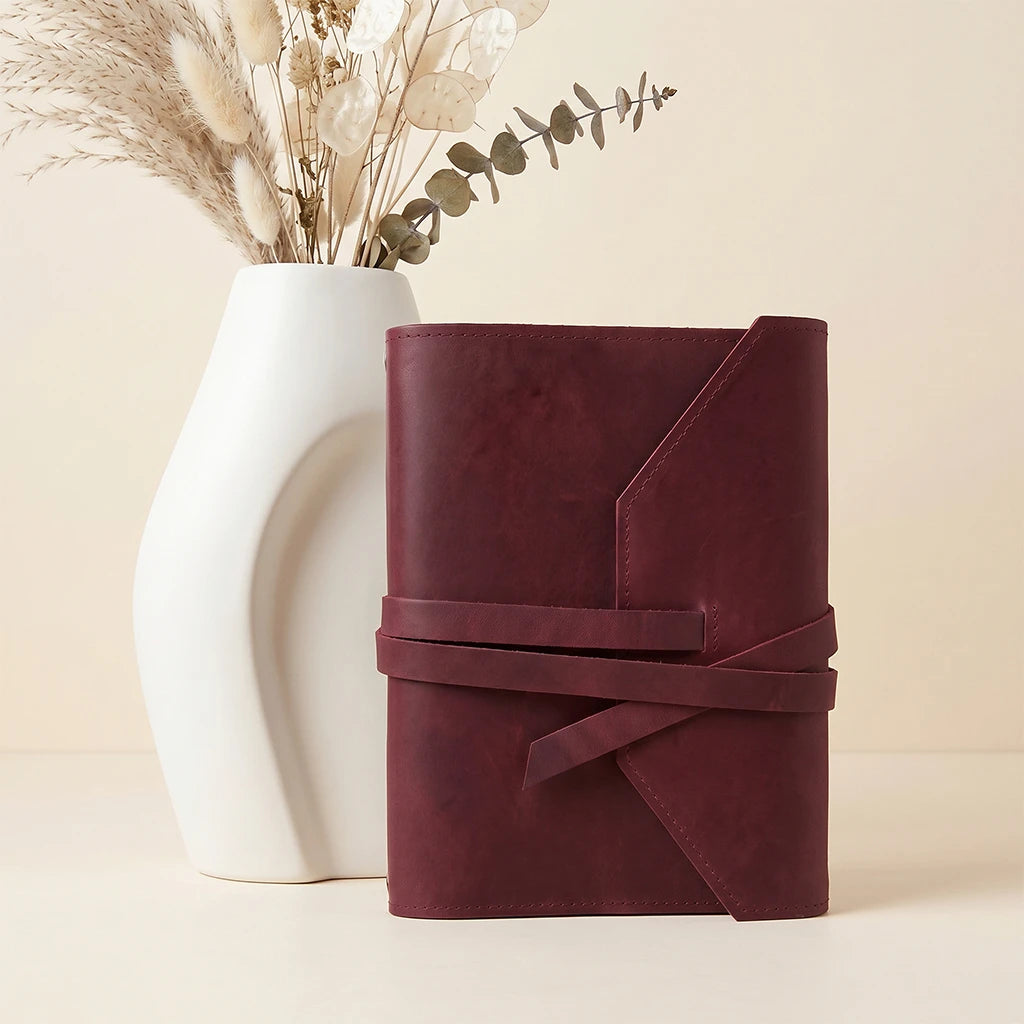 Leather notebook case offering stylish protection and convenient pen placement.