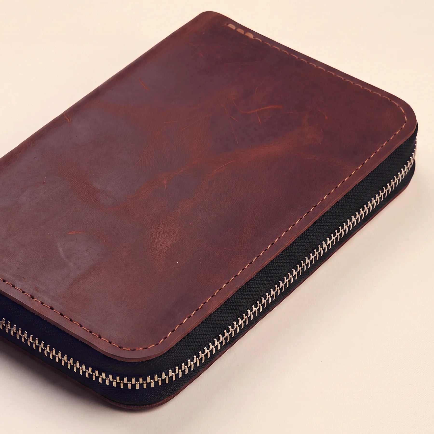 Compact handmade leather pen pouch with premium zipper and timeless craftsmanship.