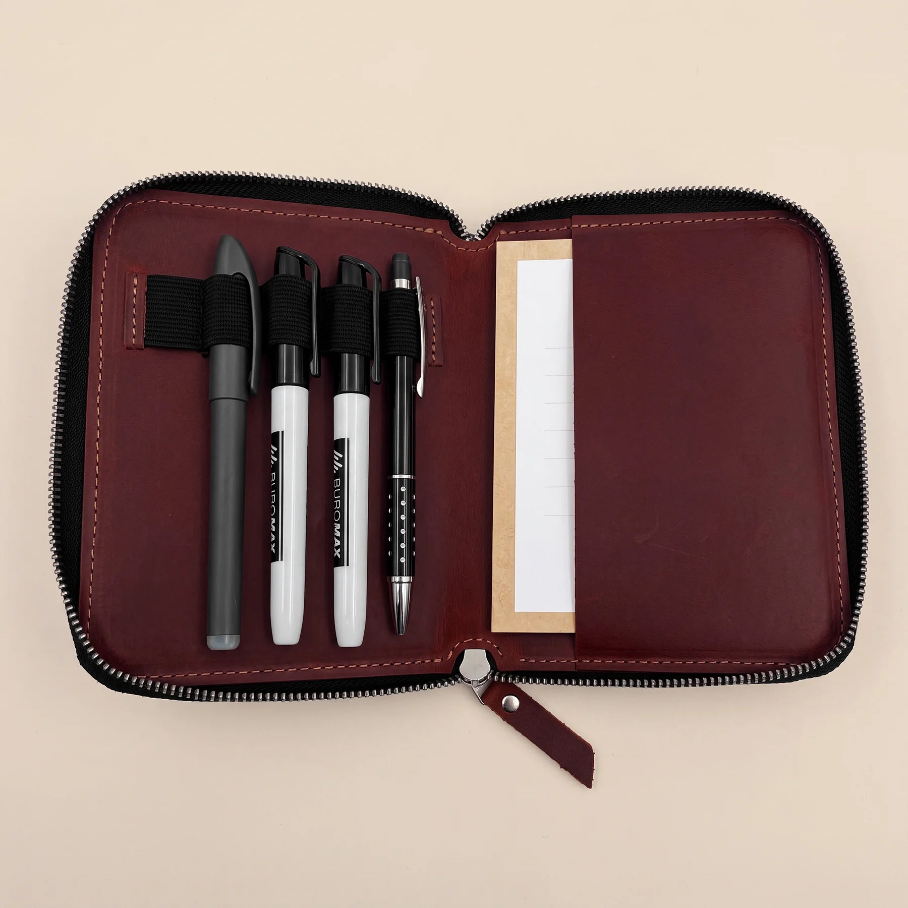 Classic leather pen keeper with zipper for carrying favorite writing instruments safely.