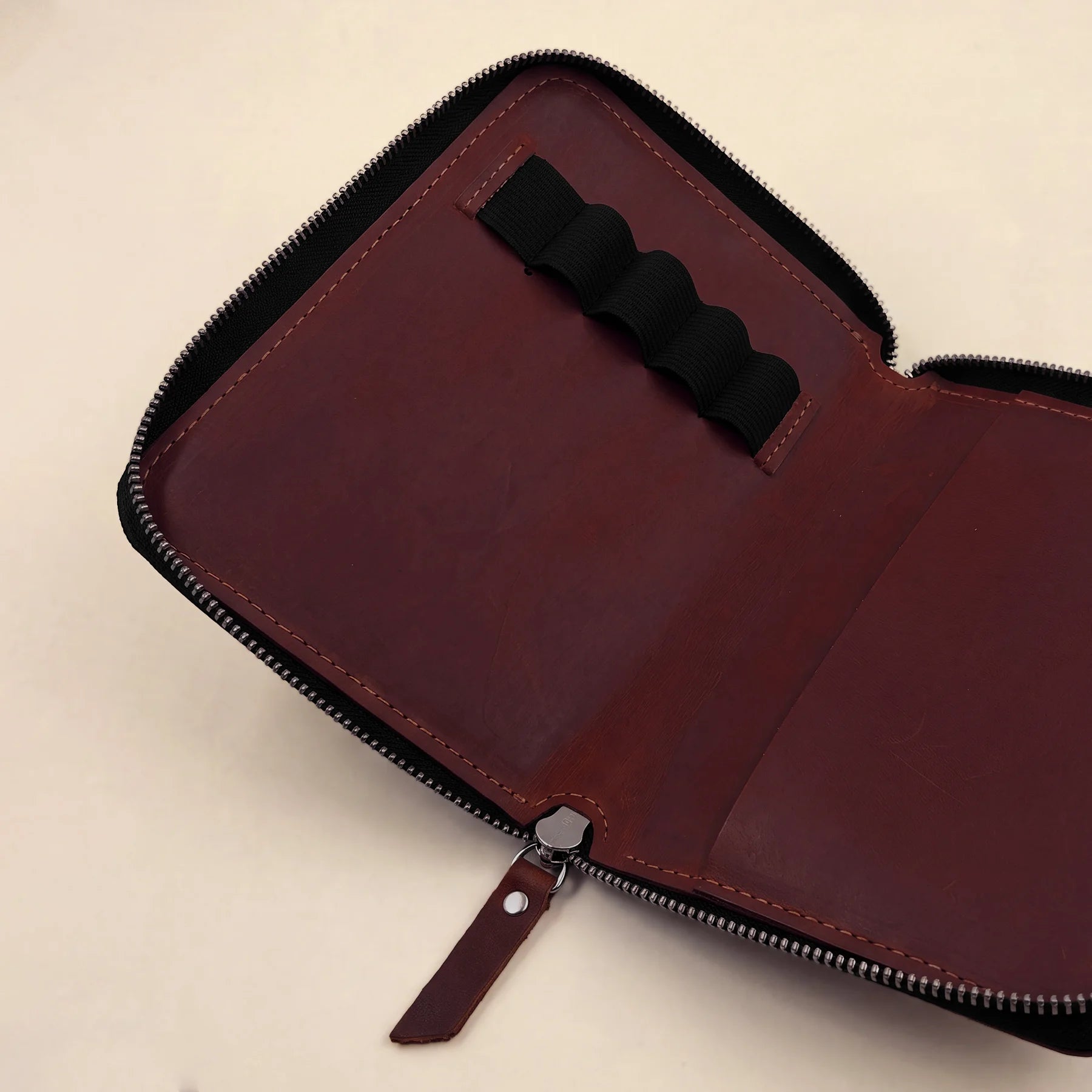Premium leather stationery holder with durable zipper and elegant minimalist silhouette.