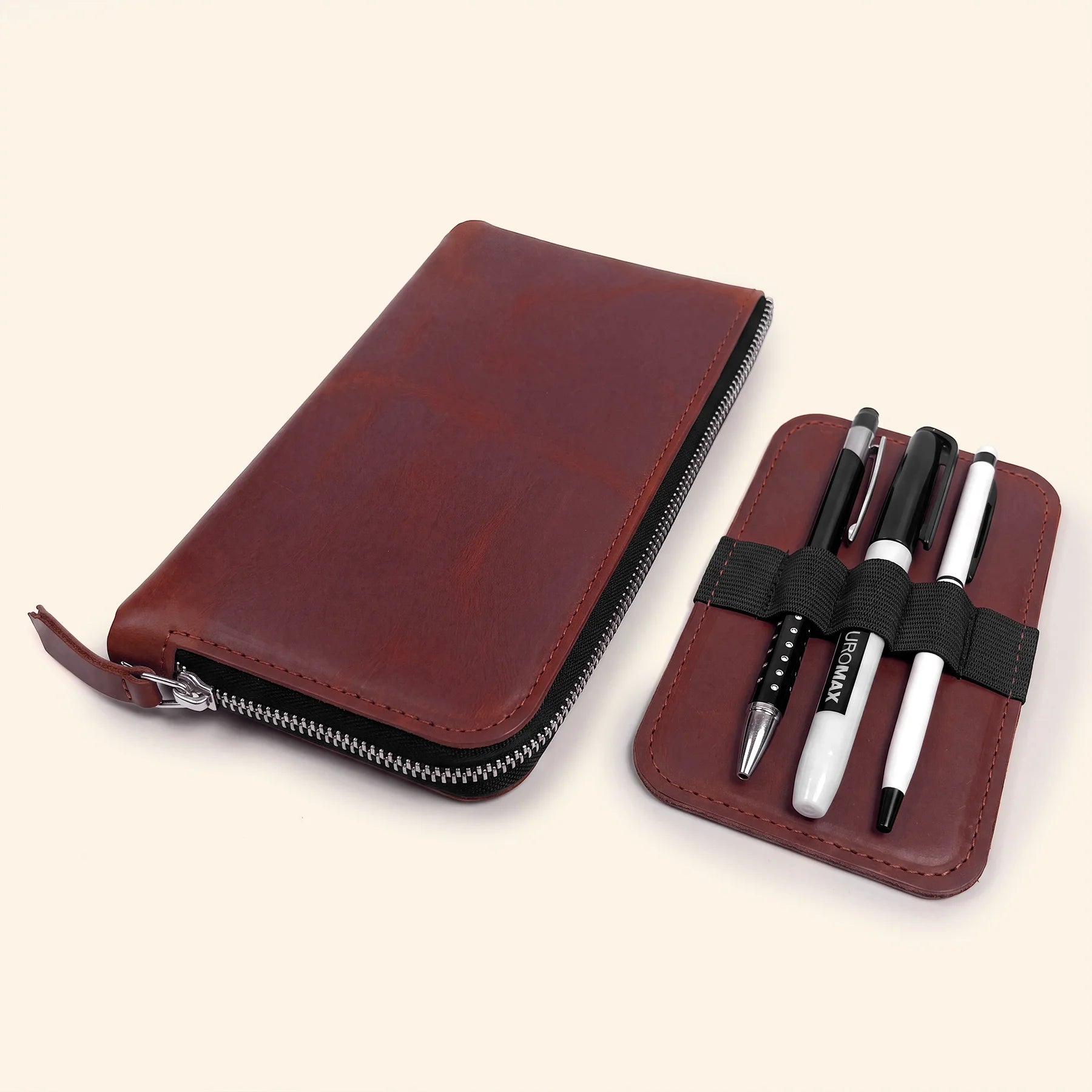 Genuine leather zip pouch offering organized storage for pens and creative accessories.