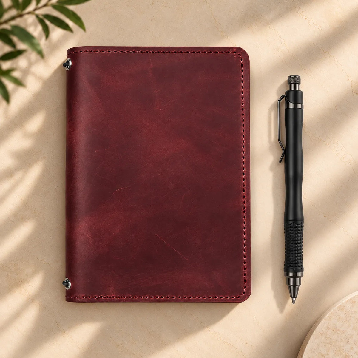 Natural leather cover with two elastic straps and functional pockets inside the journal.