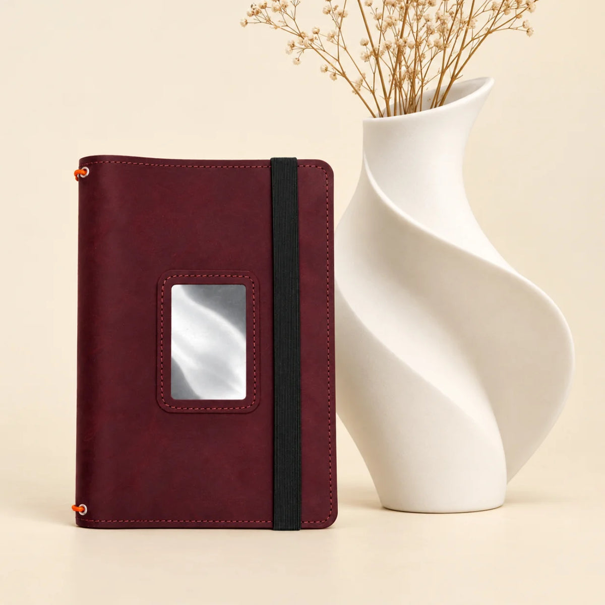 Natural leather journal holder featuring three bands and convenient pockets for stationery essentials.