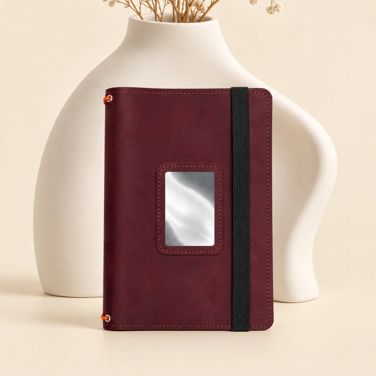 Leather notebook cover featuring three secure elastic bands and useful inner pockets.