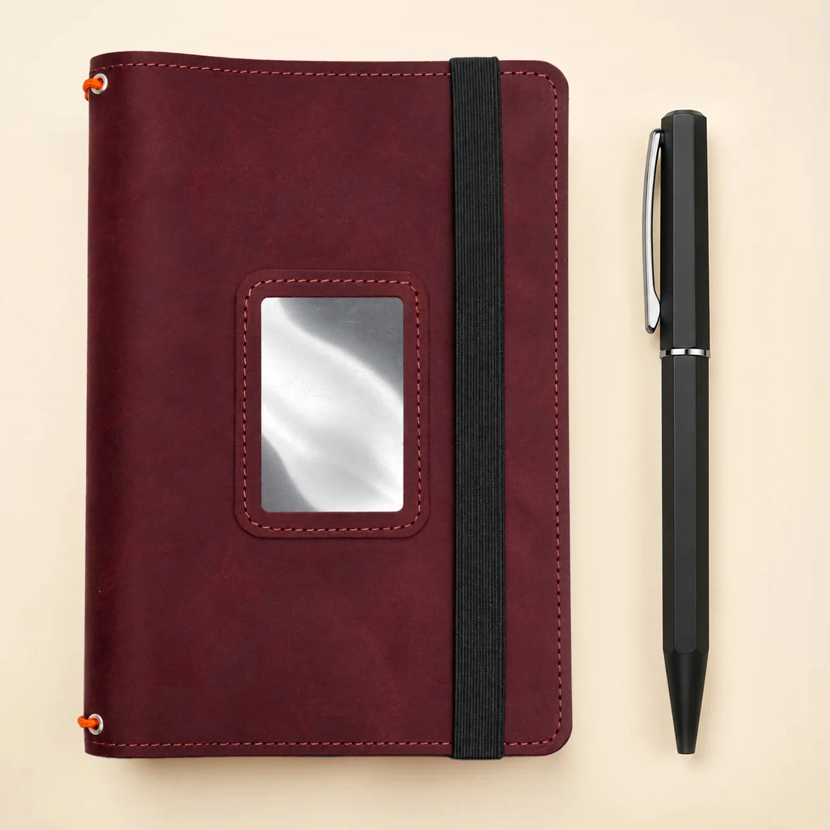Handmade natural leather journal cover with three elastic bands and practical interior pockets.