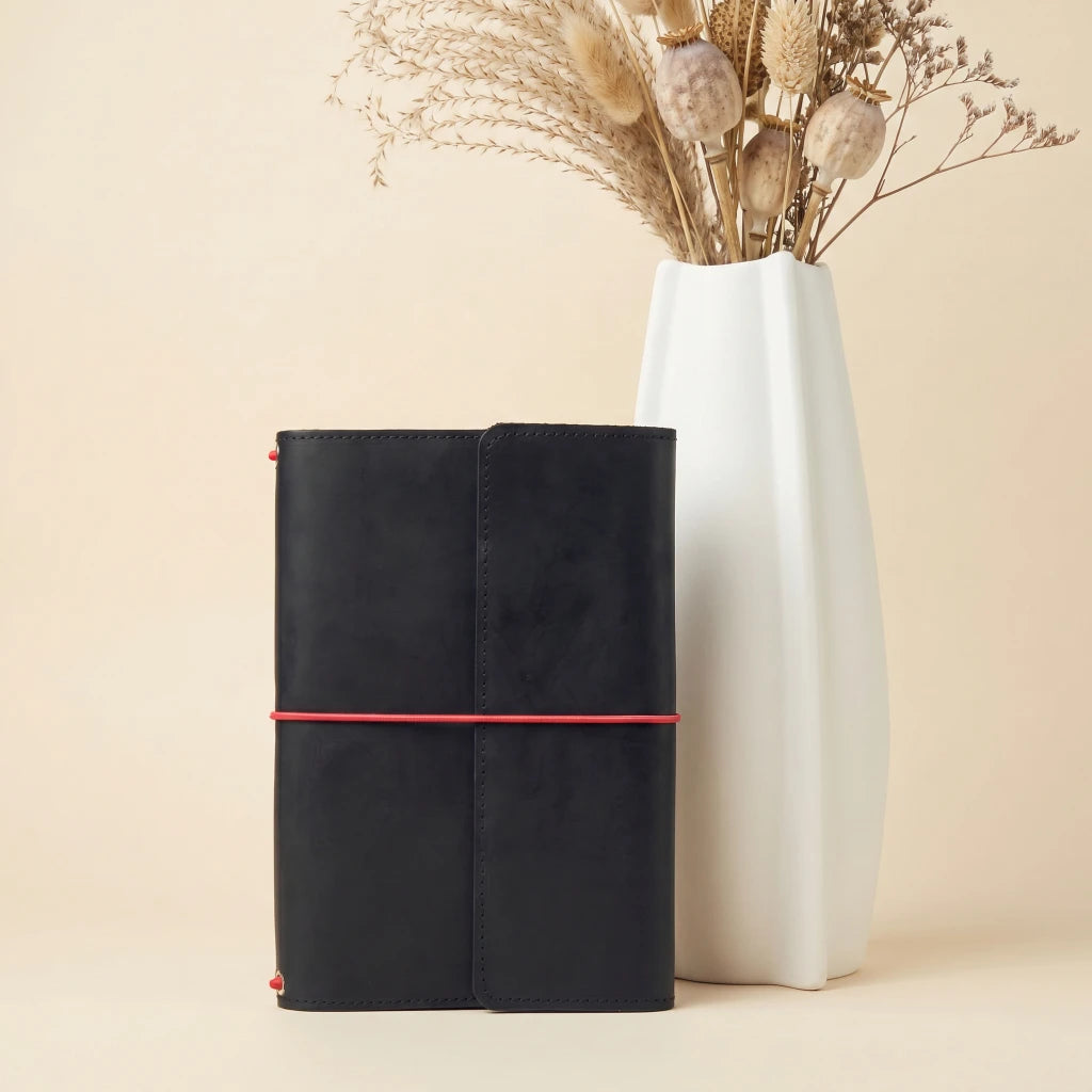 Handmade leather organizer cover with elastic straps and built-in pen holder loop