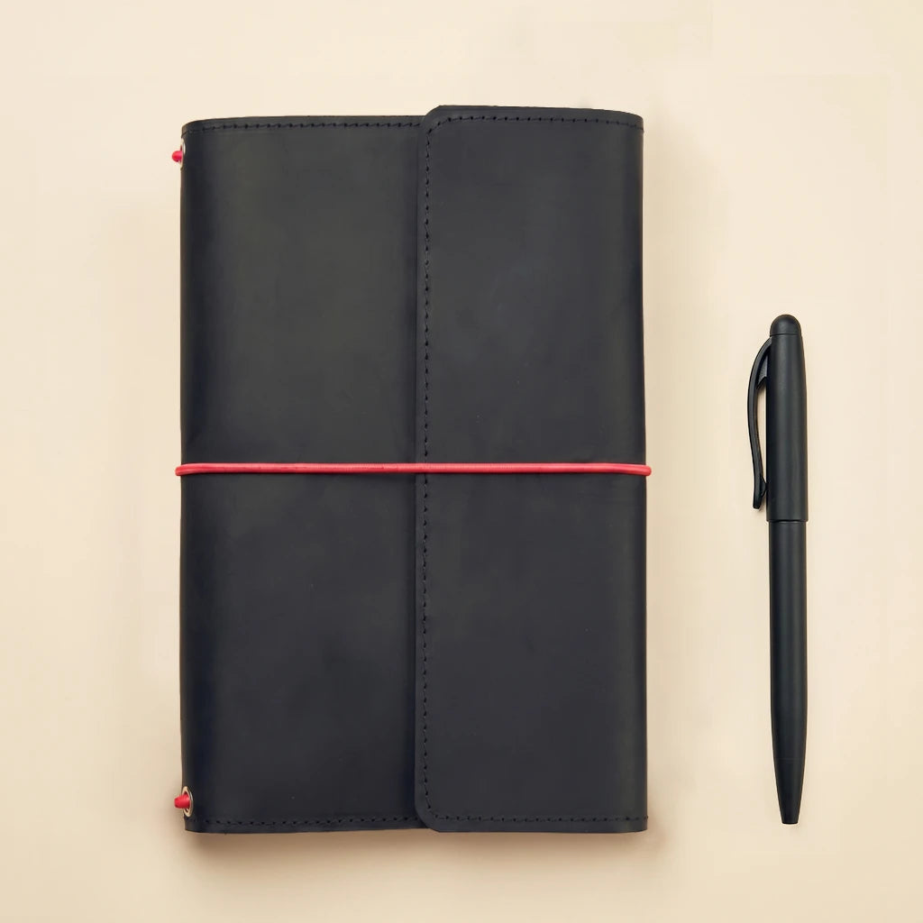 Functional leather journal cover with elastic bands, card storage, and pen loop