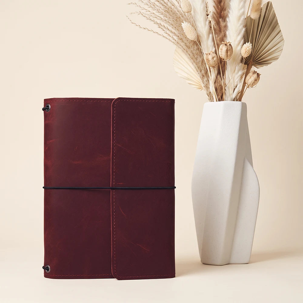 Leather notebook case combining handcrafted quality with organized refillable journal functionality.
