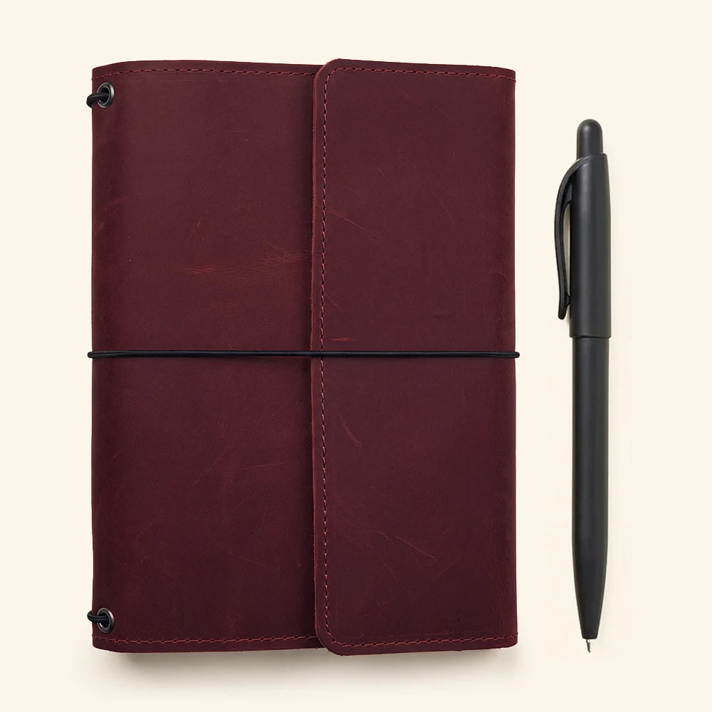Genuine leather notebook wrap with handcrafted quality and organized elastic journal insert system.