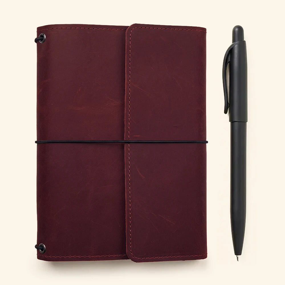Stylish leather notebook cover featuring refillable design, pockets, and secure elastic closures inside.