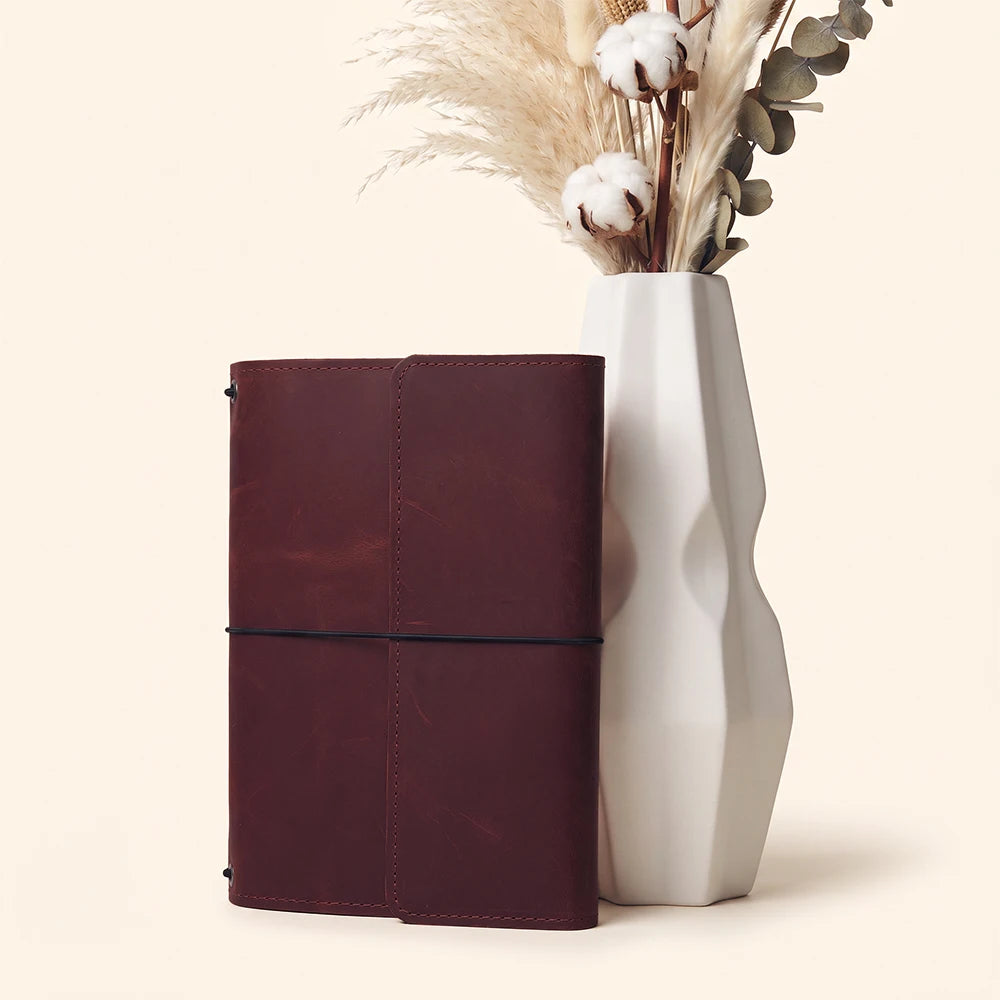 Genuine leather planner organizer with three elastic bands and practical inside storage features.