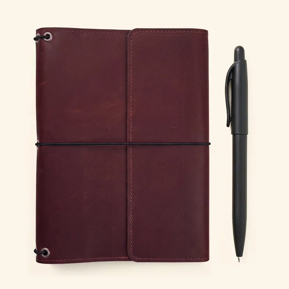 Classic leather journal organizer combining handcrafted quality with functional interior pocket design.