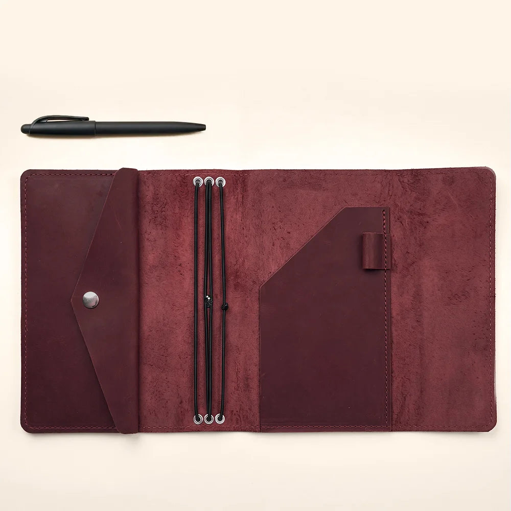 Genuine leather notebook organizer with premium stitching and functional storage for daily essentials.