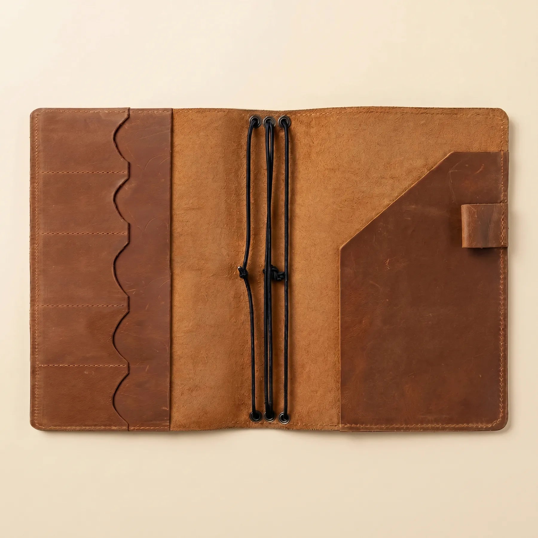 Rustic leather planner holder featuring strong stitching and authentic character.