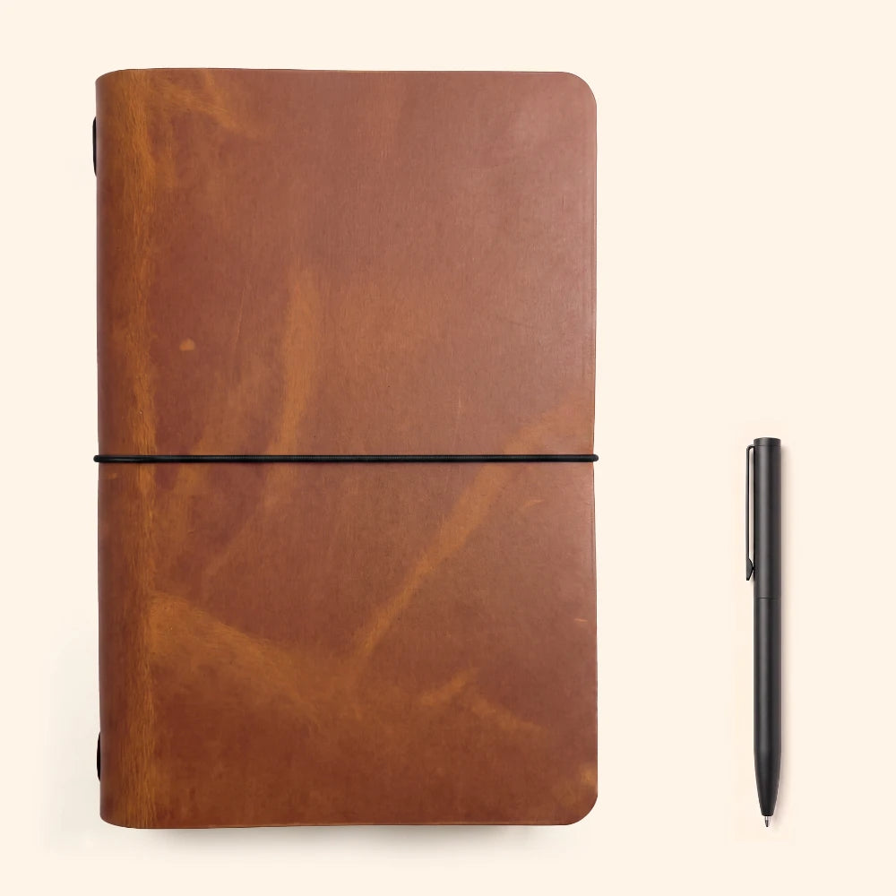 Handmade leather writing cover with practical construction and timeless natural texture.