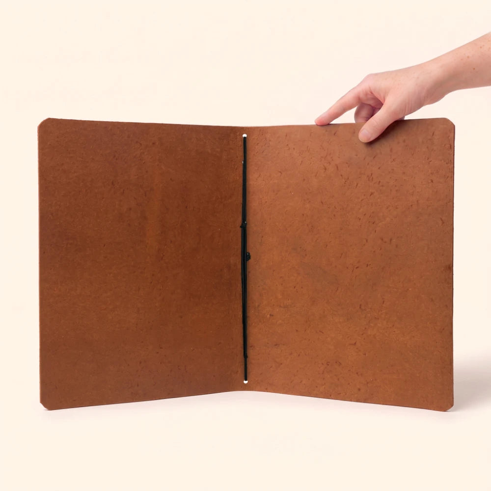 Genuine leather notebook wrap designed to complement simple and focused daily writing.