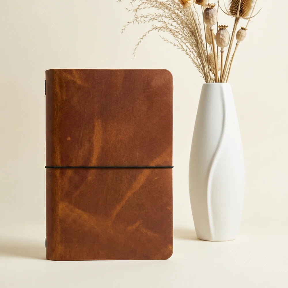 Compact handmade journal cover offering durable leather protection for everyday writing.