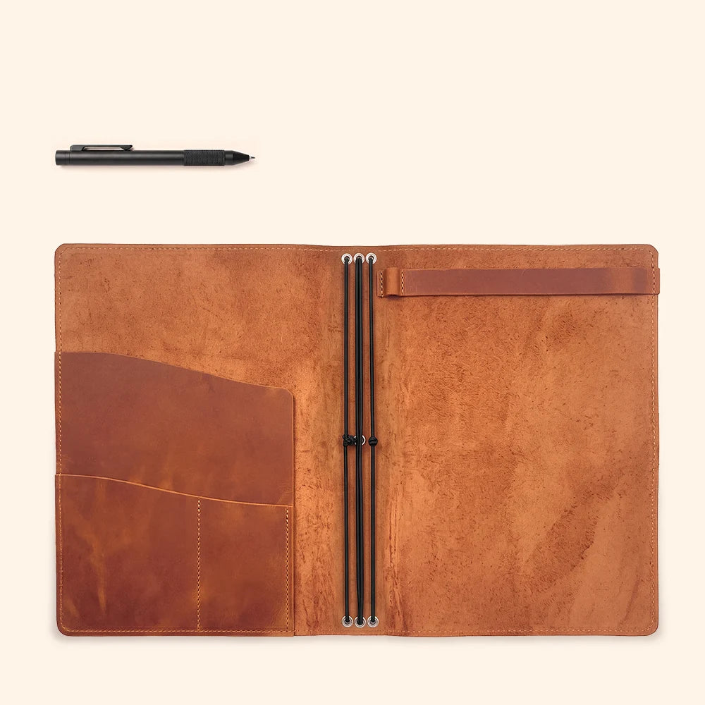 Genuine leather cover with flexible attachment cords for replacing notebook inserts easily.