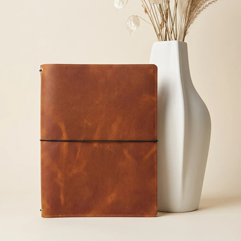Handmade journal cover featuring practical pockets and a dedicated sketchbook section.