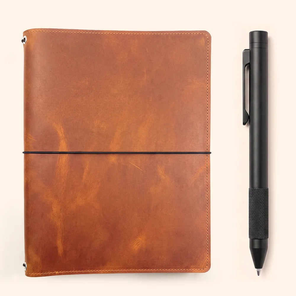 Leather notebook holder with three elastic bands, practical pockets, and secure sketchbook fastening.