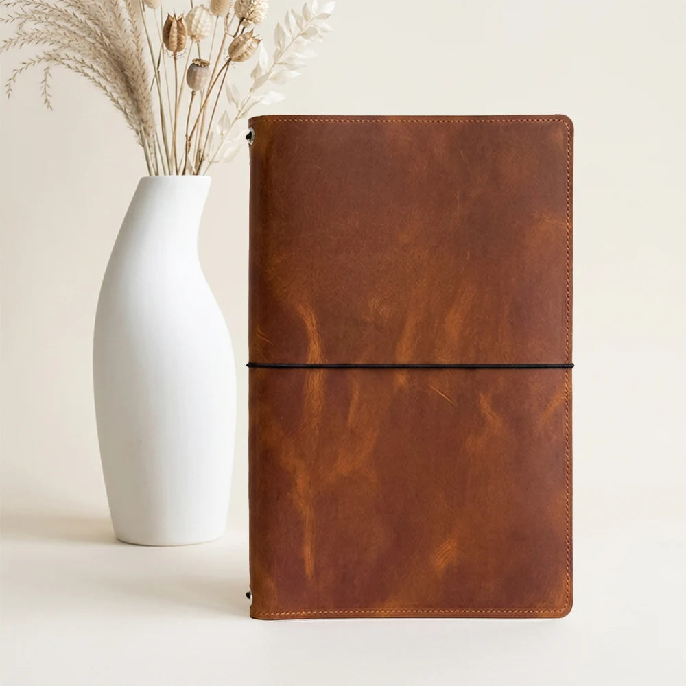 Handmade leather notebook cover built for keeping journals and sketchbooks together.