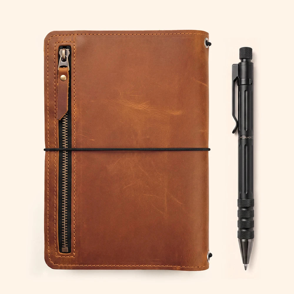 Genuine leather writing organizer featuring notebook pocket, accessory sleeves, and pen holder.