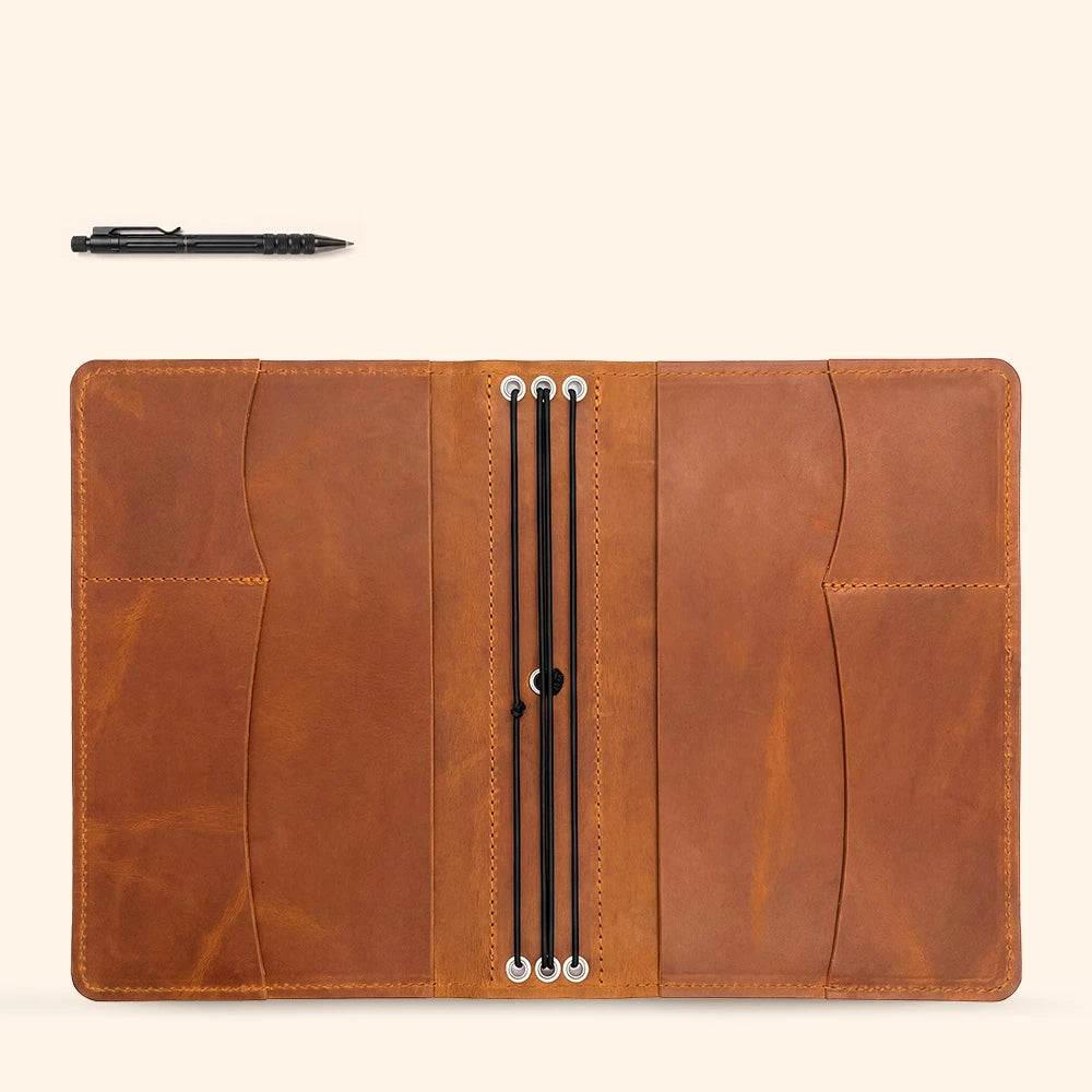 Handcrafted leather notebook folio with document pockets and elegant pen storage solution.