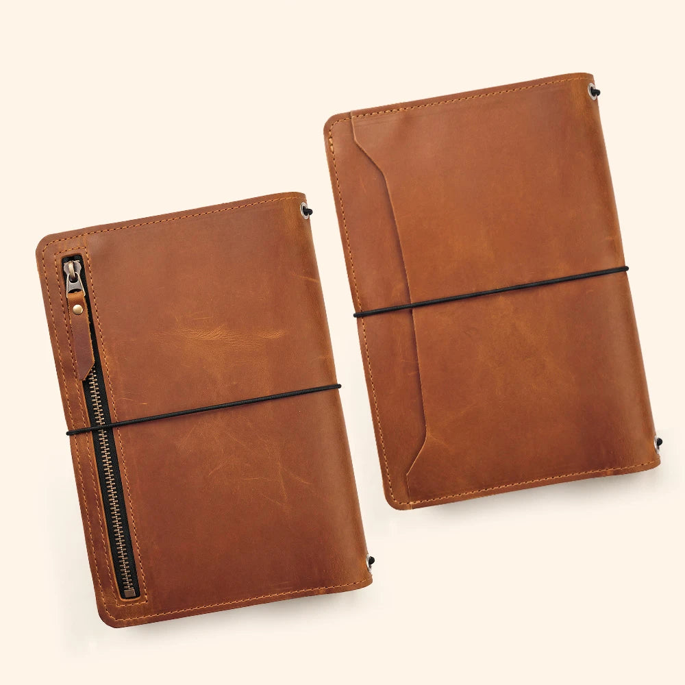 Handmade leather planner cover with elegant inner pockets and durable pen holder loop.