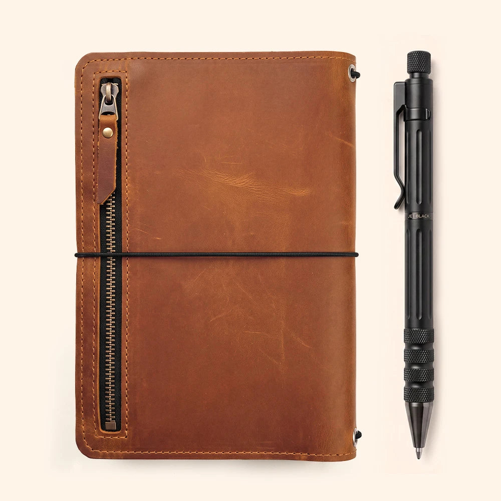 Refillable leather journal cover with spacious interior pockets and practical leather pen loop.
