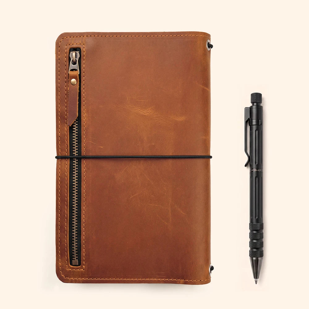 Refillable leather notebook carrier designed with functional compartments for daily essentials.