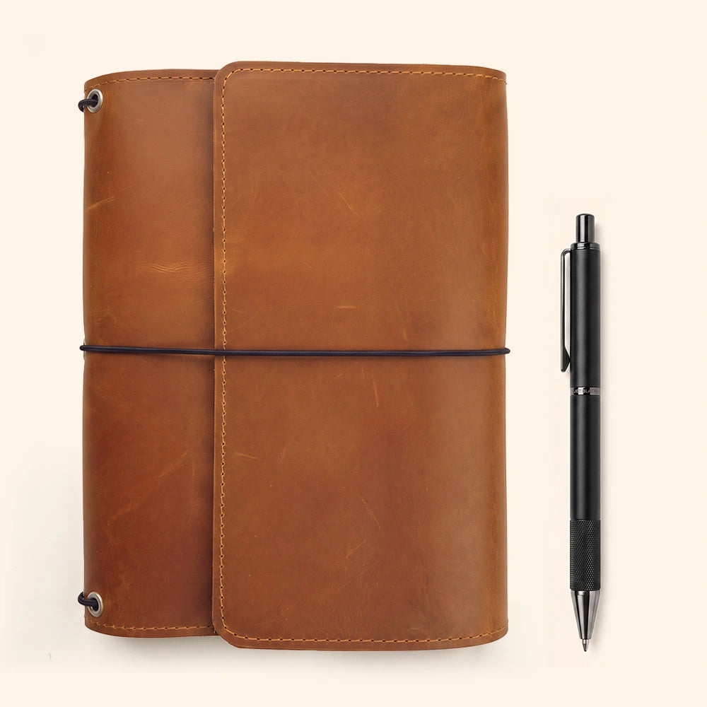 Genuine leather notebook protector featuring organized pockets and elegant pen carrying sleeve.