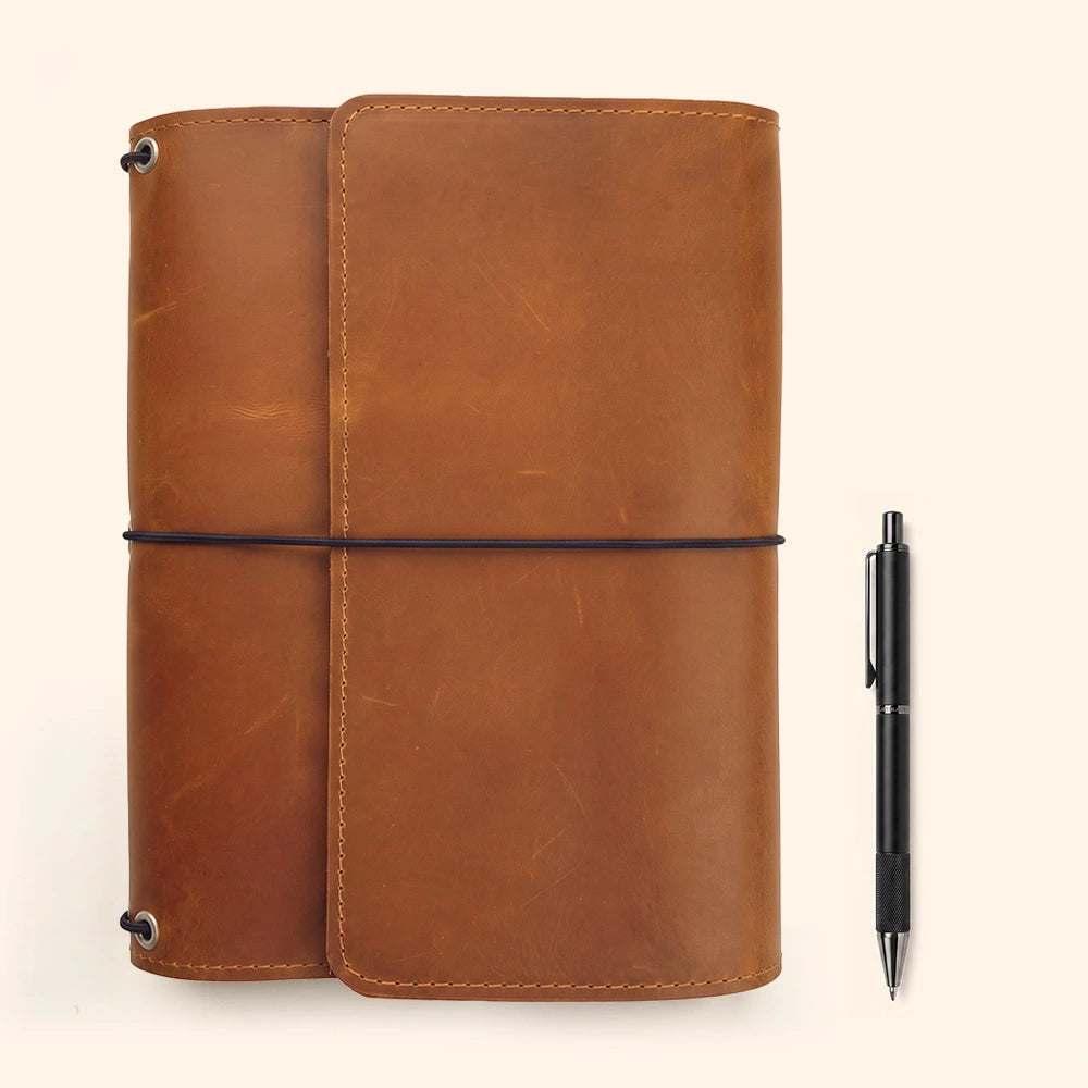 Genuine leather notebook binder organizer with functional compartments and secure writing accessory loop.