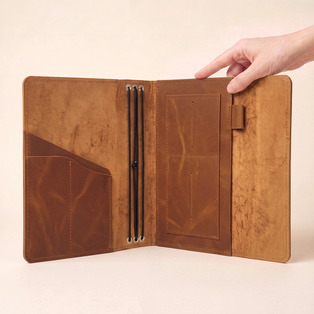 Leather planner wallet featuring spacious interior compartments and practical leather pen holder.