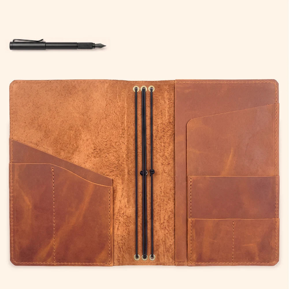 Compact handmade leather cover for creating a personalized multi-insert journal.