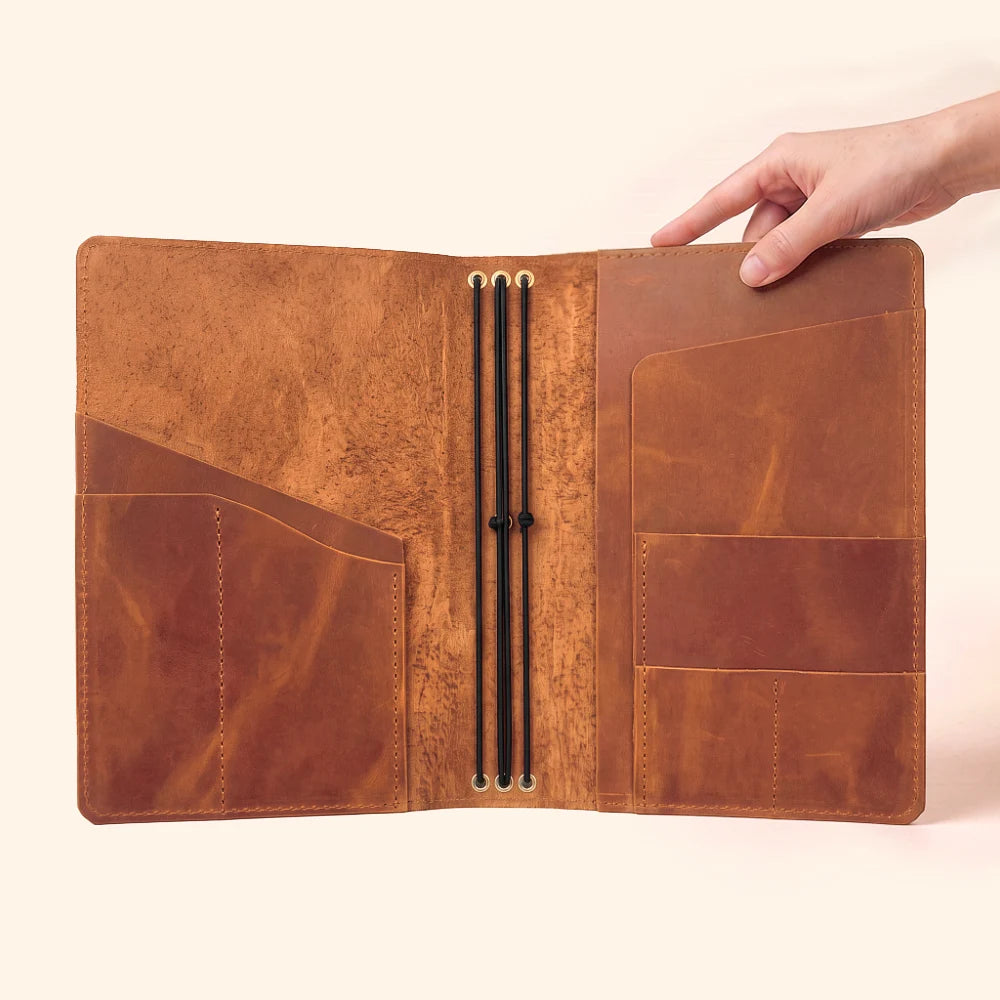 Natural leather journal wrap designed for a flexible three-notebook configuration.