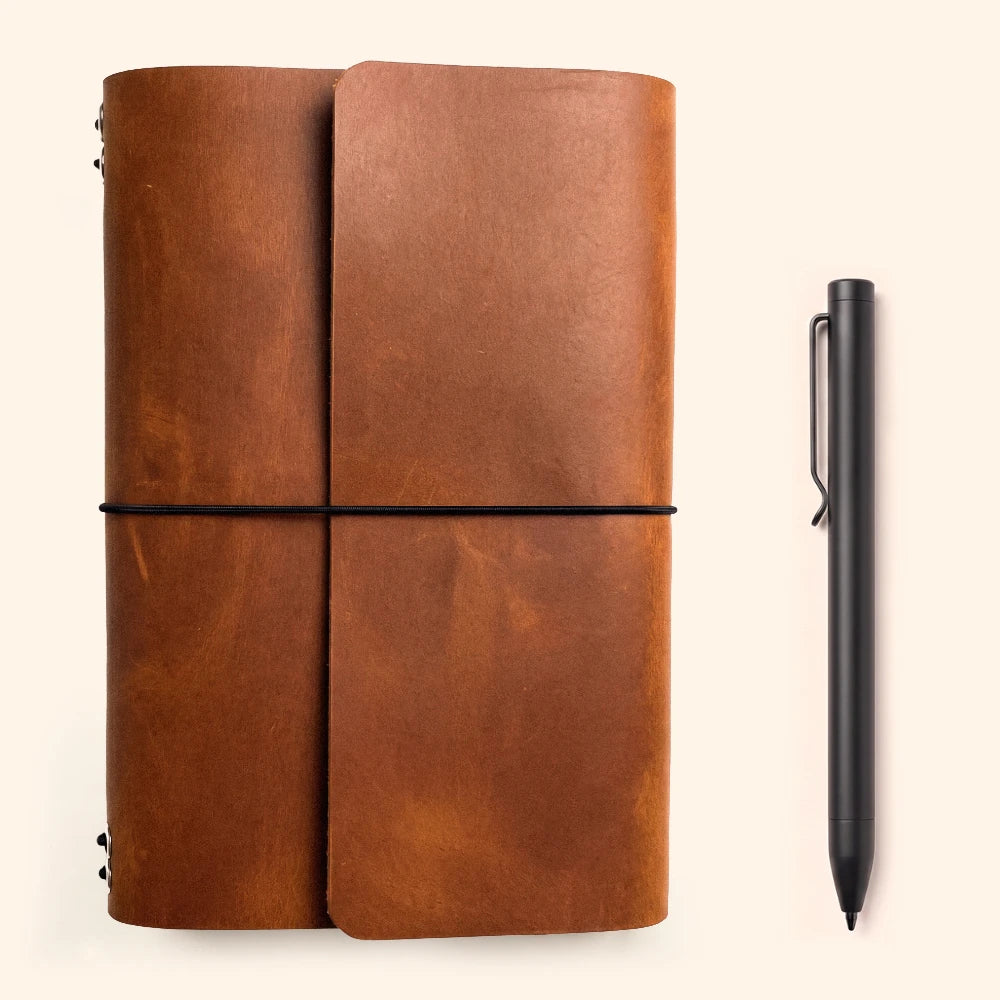 Genuine leather journal organizer with six stretch cords for removable writing notebooks.