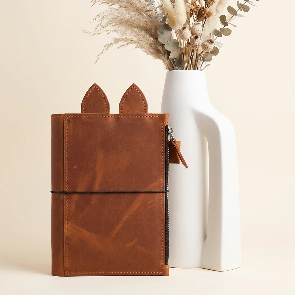 Genuine leather notebook organizer with spacious storage for pens, notes, and accessories.