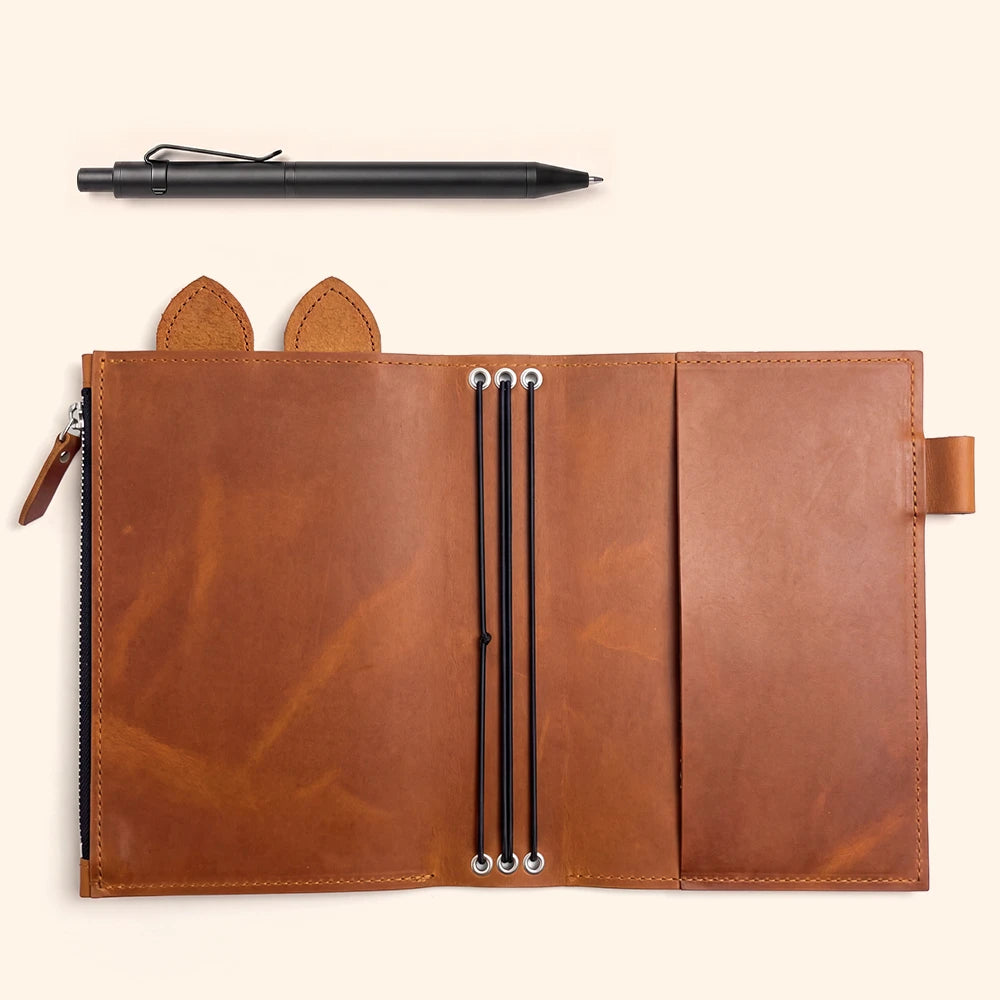 Genuine leather travel journal cover with large zipper compartment, pen loop, leather ears, and bands.