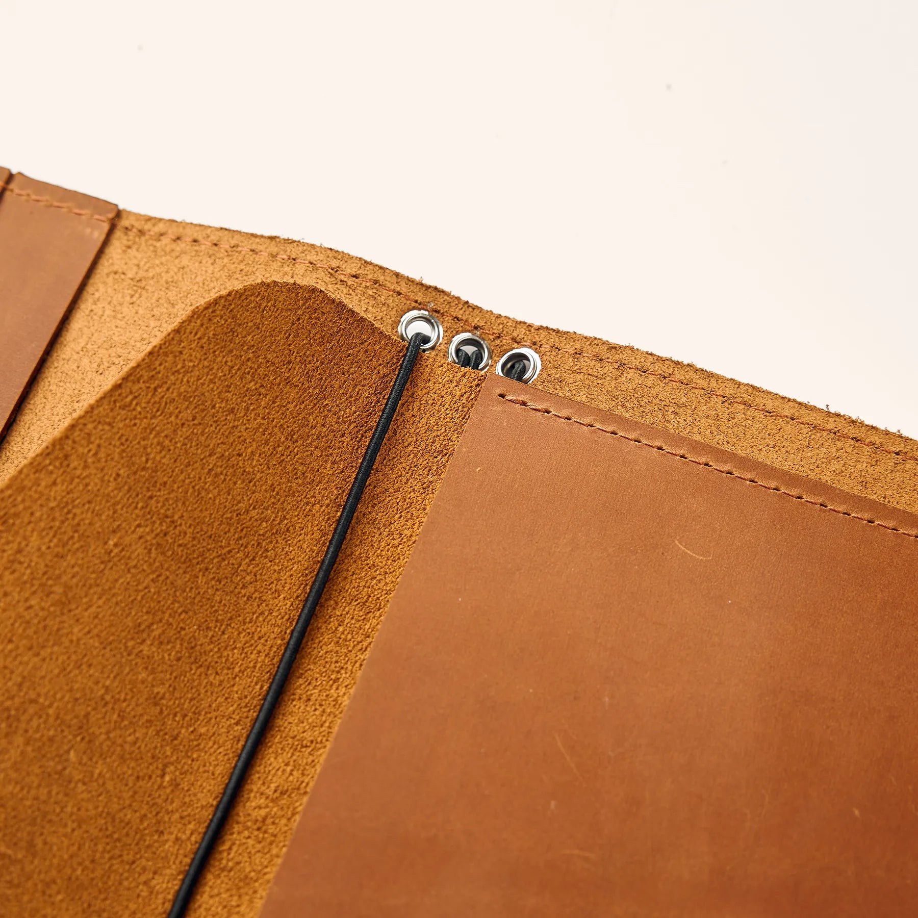 Refillable leather notebook insert shaped like an envelope pouch