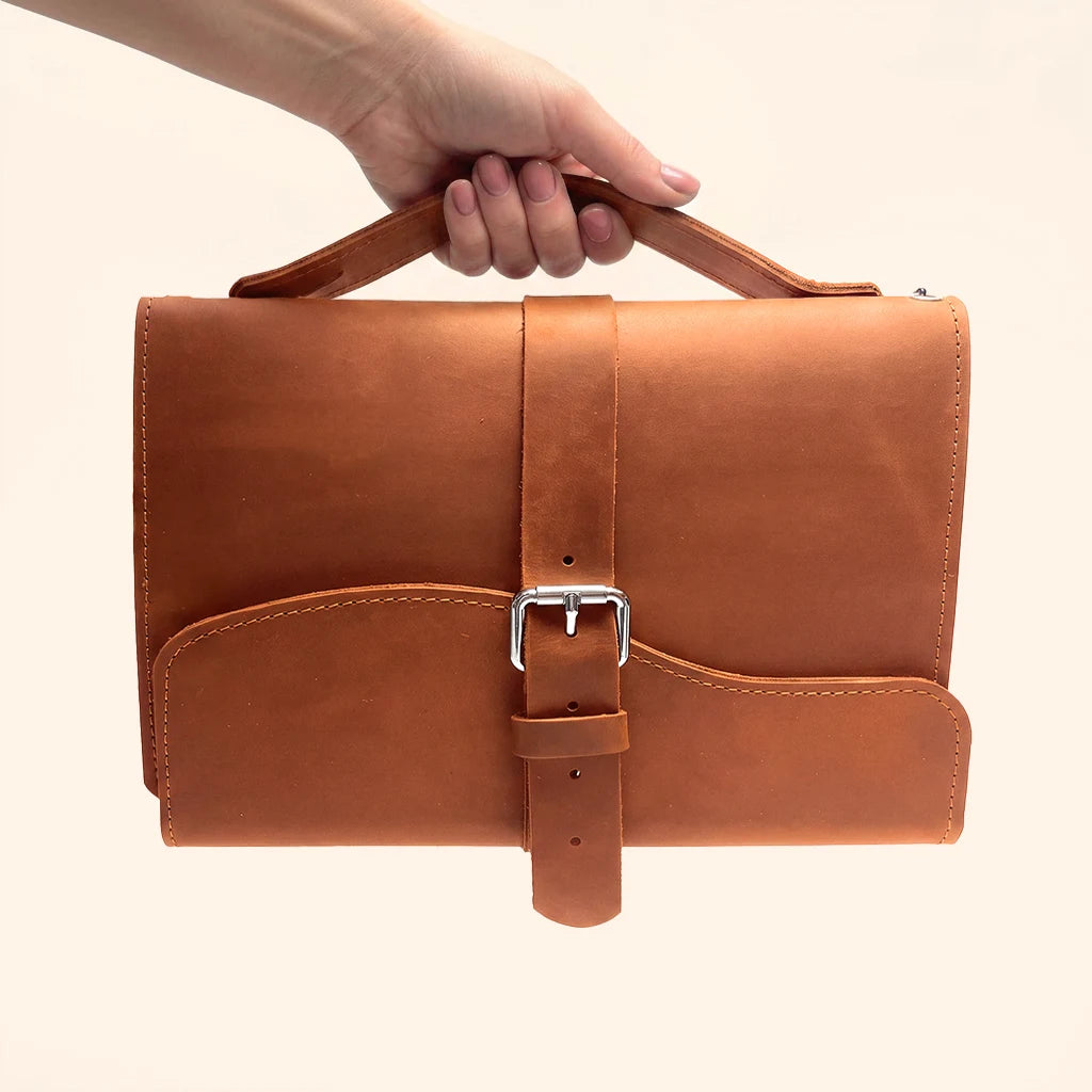 Functional genuine leather notebook cover with three elastic loops and an exterior handle.