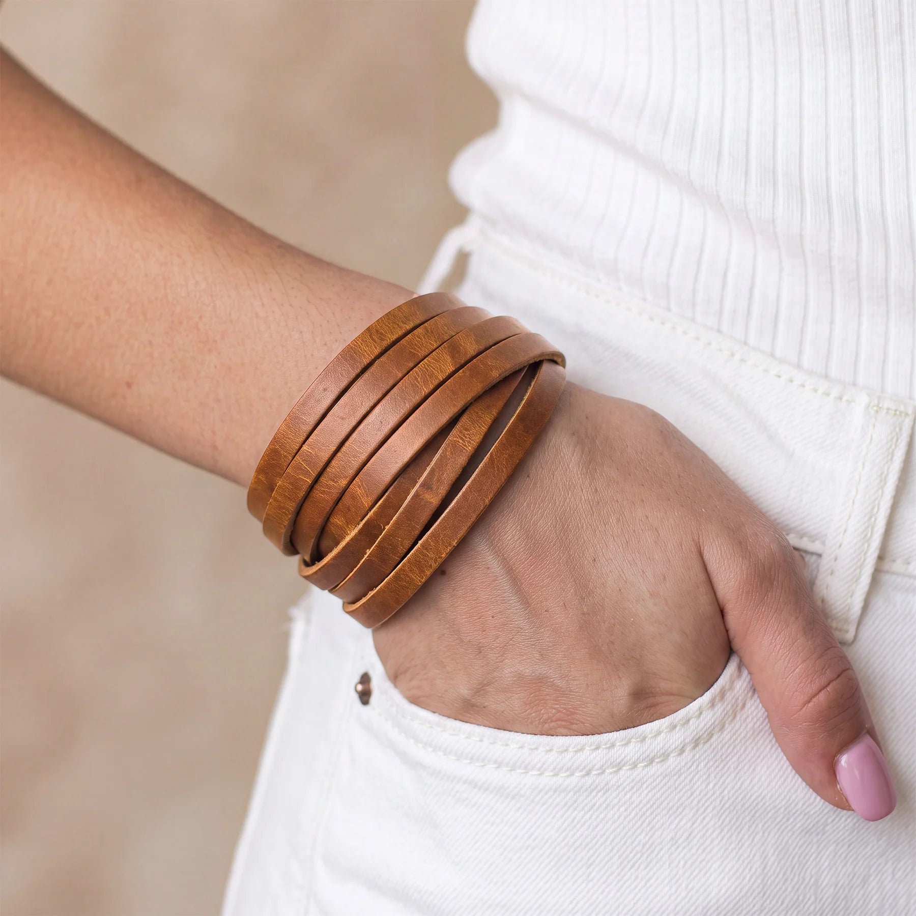 Handmade genuine leather bracelet designed with sturdy snap button and timeless appearance.