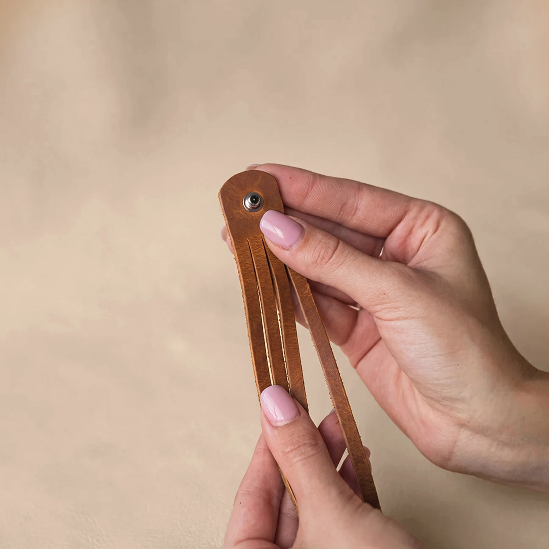 Handcrafted leather bracelet featuring premium natural leather and classic snap button closure.
