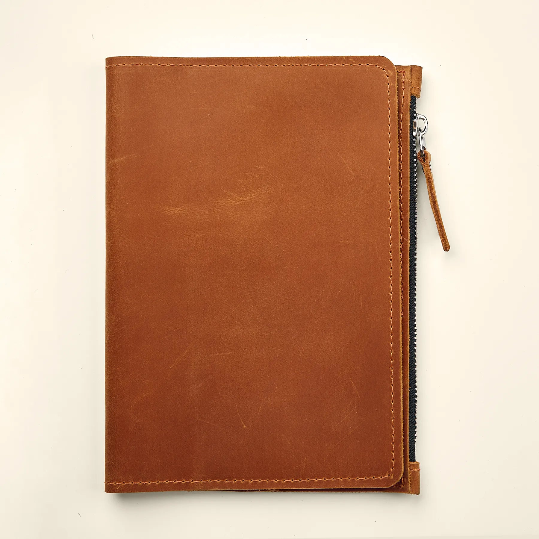 Genuine leather notebook insert with slim profile and functional storage compartments.
