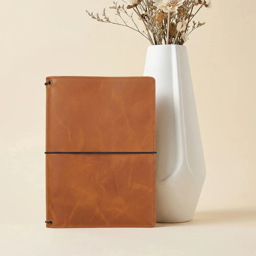 Leather notebook cover with handcrafted quality and practical organizer pocket arrangement.