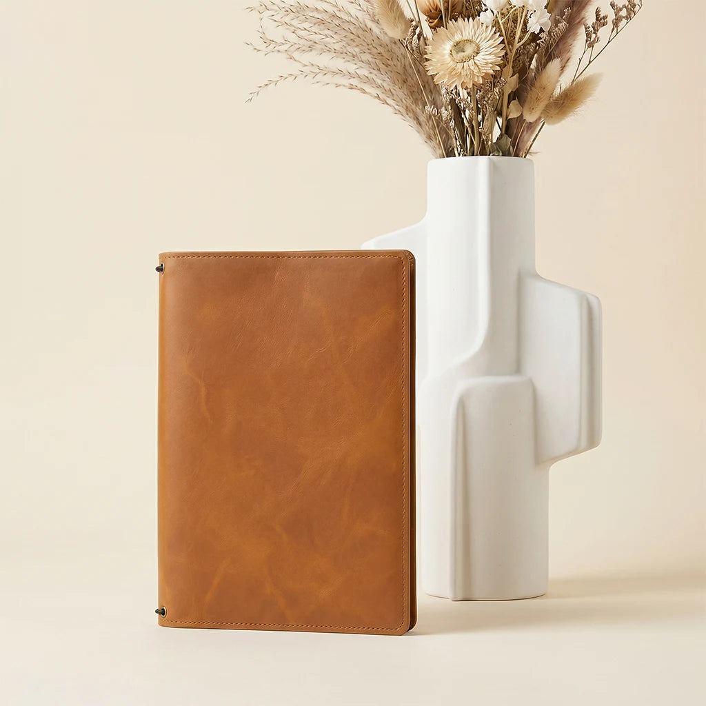 Leather travel journal case designed for organization and daily writing.