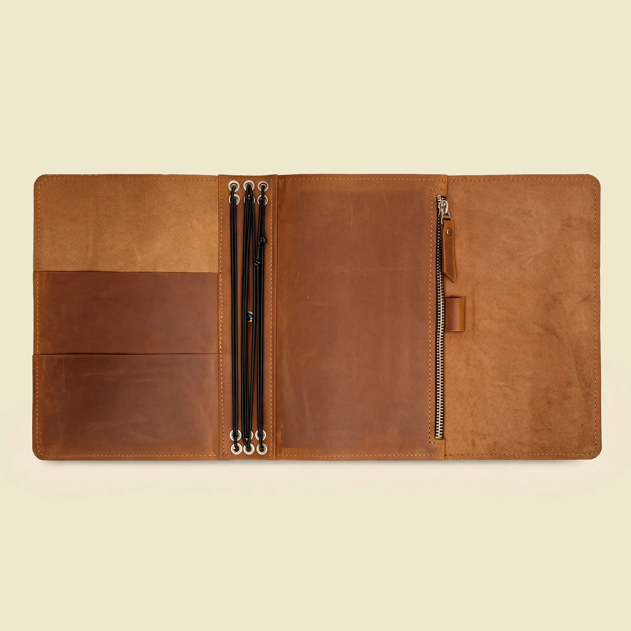 Genuine leather journal cover offering flexible insert storage and dedicated sketchbook support.