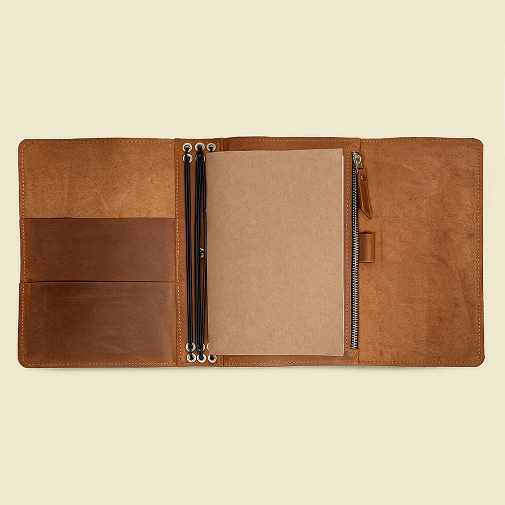 Genuine leather notebook cover with interior pockets and six elastic bands for inserts.